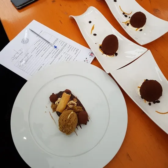 The desserts made by the school pupils on the jury table