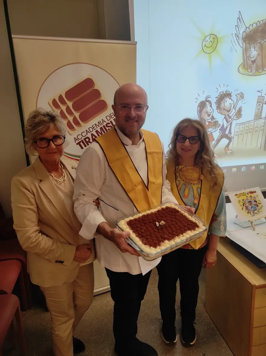 Reading the Tiramisù fairy-tale book at the BRAT library for the children of Treviso